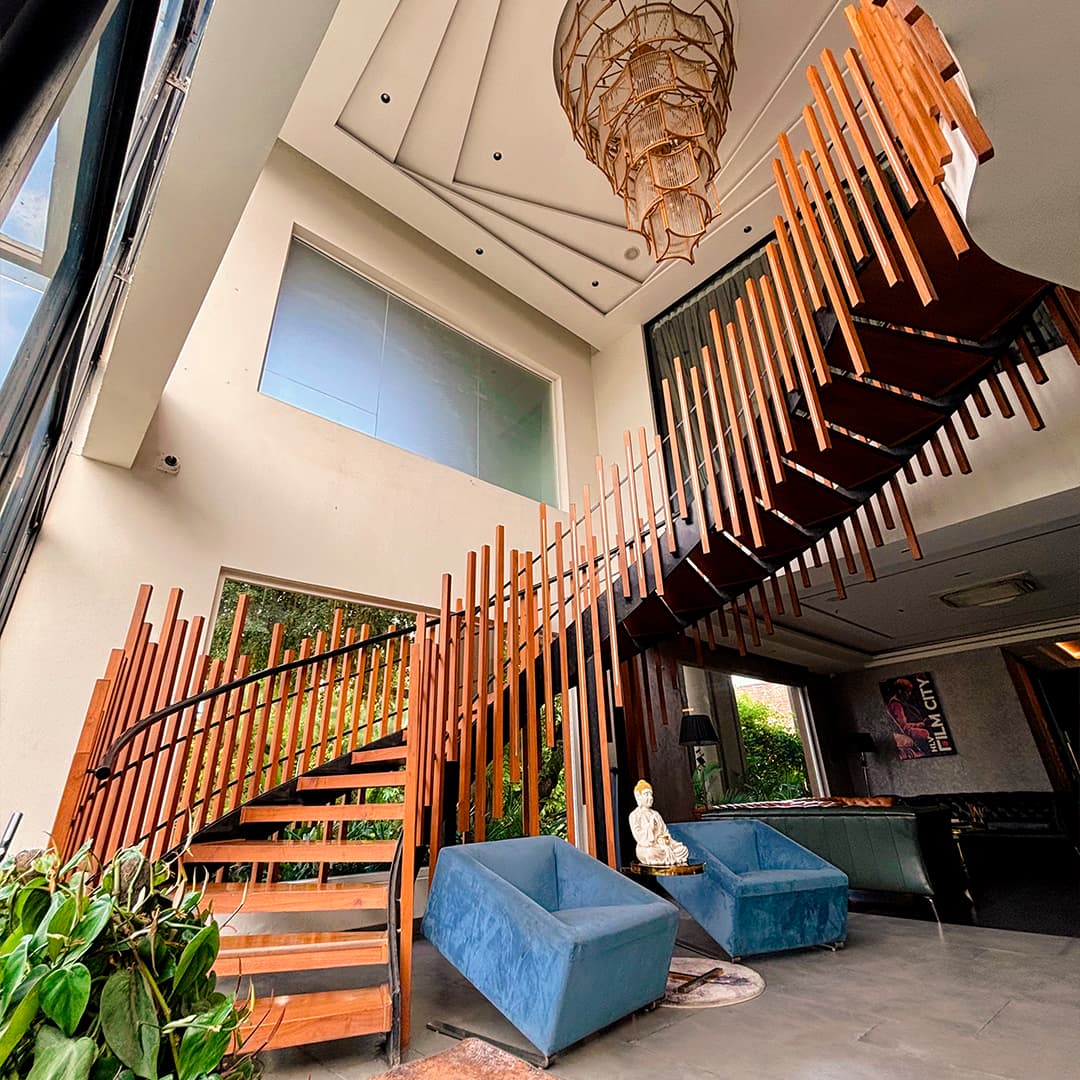 Interior lobby with sculptural wooden staircase